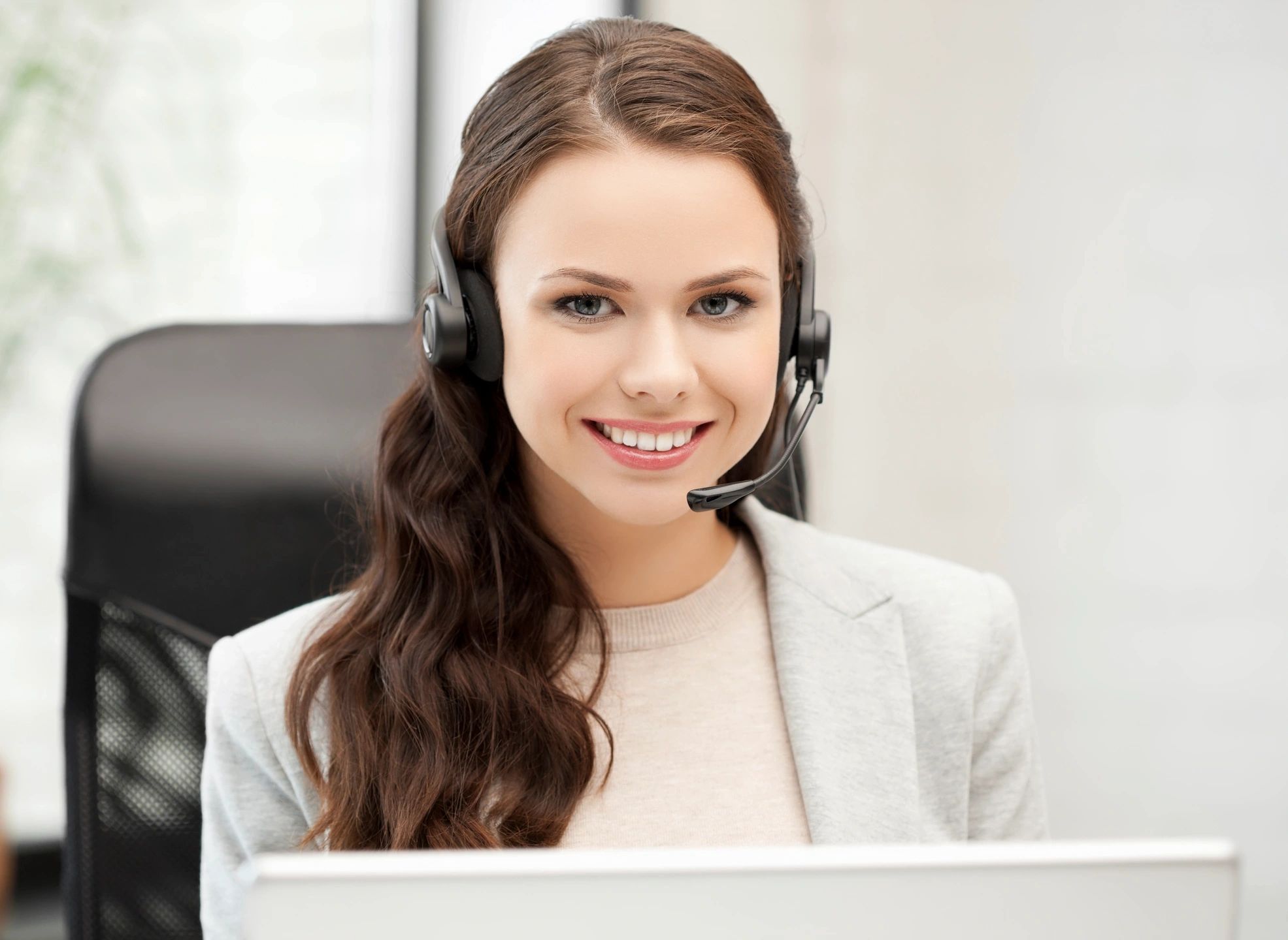 Headset support professional in a bright office