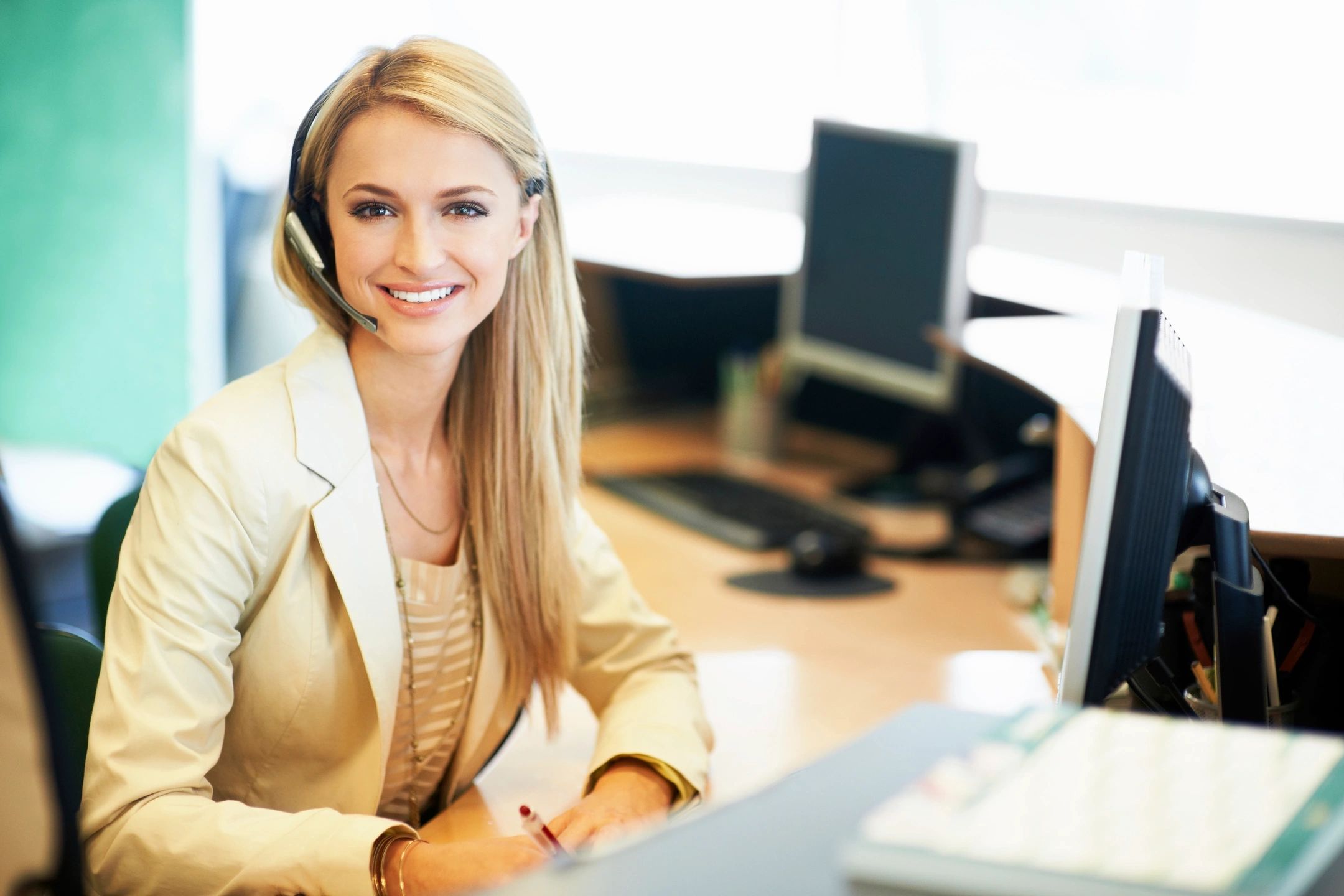 Customer service professional at a desk