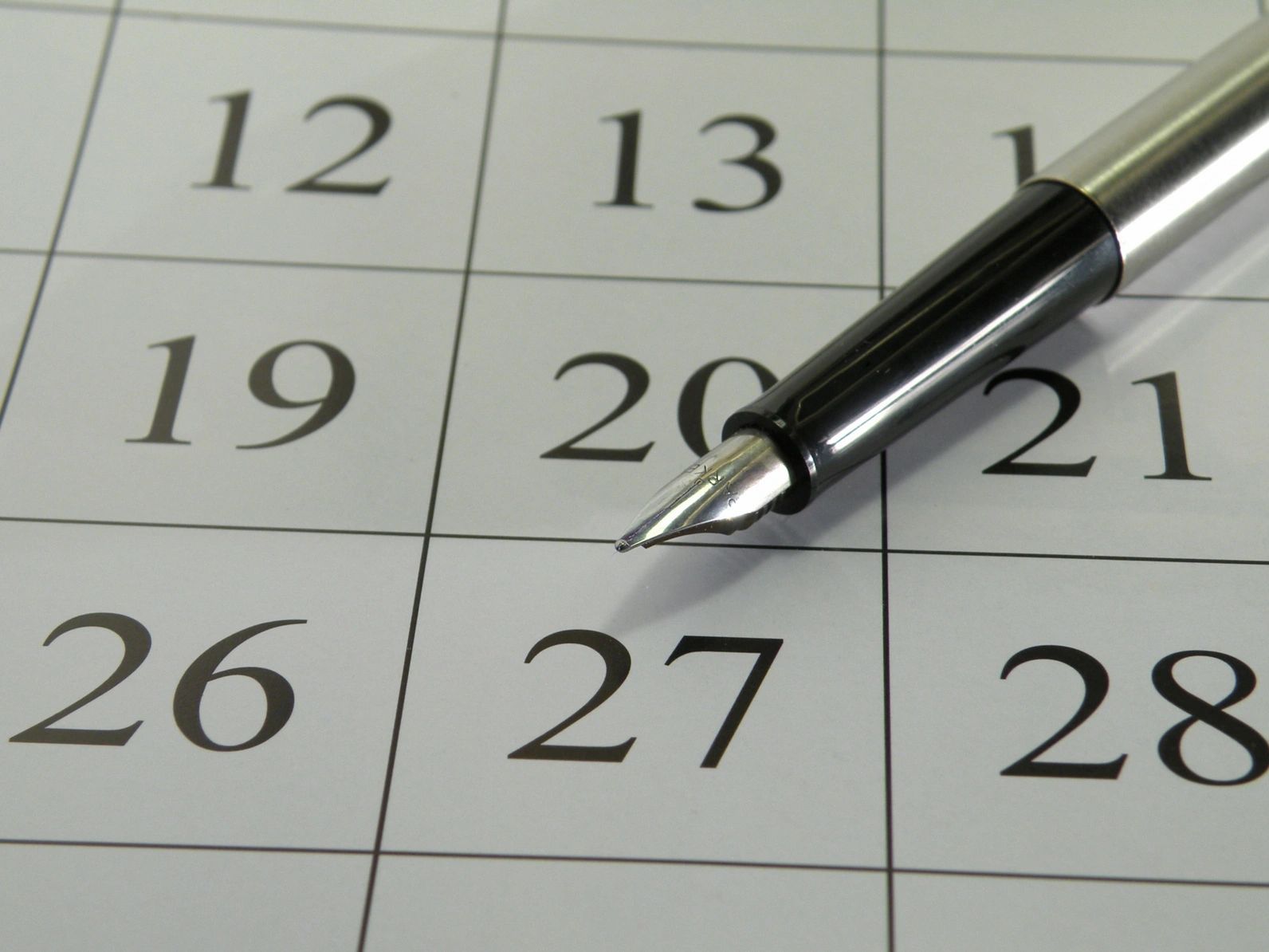 Planning calendar with fountain pen